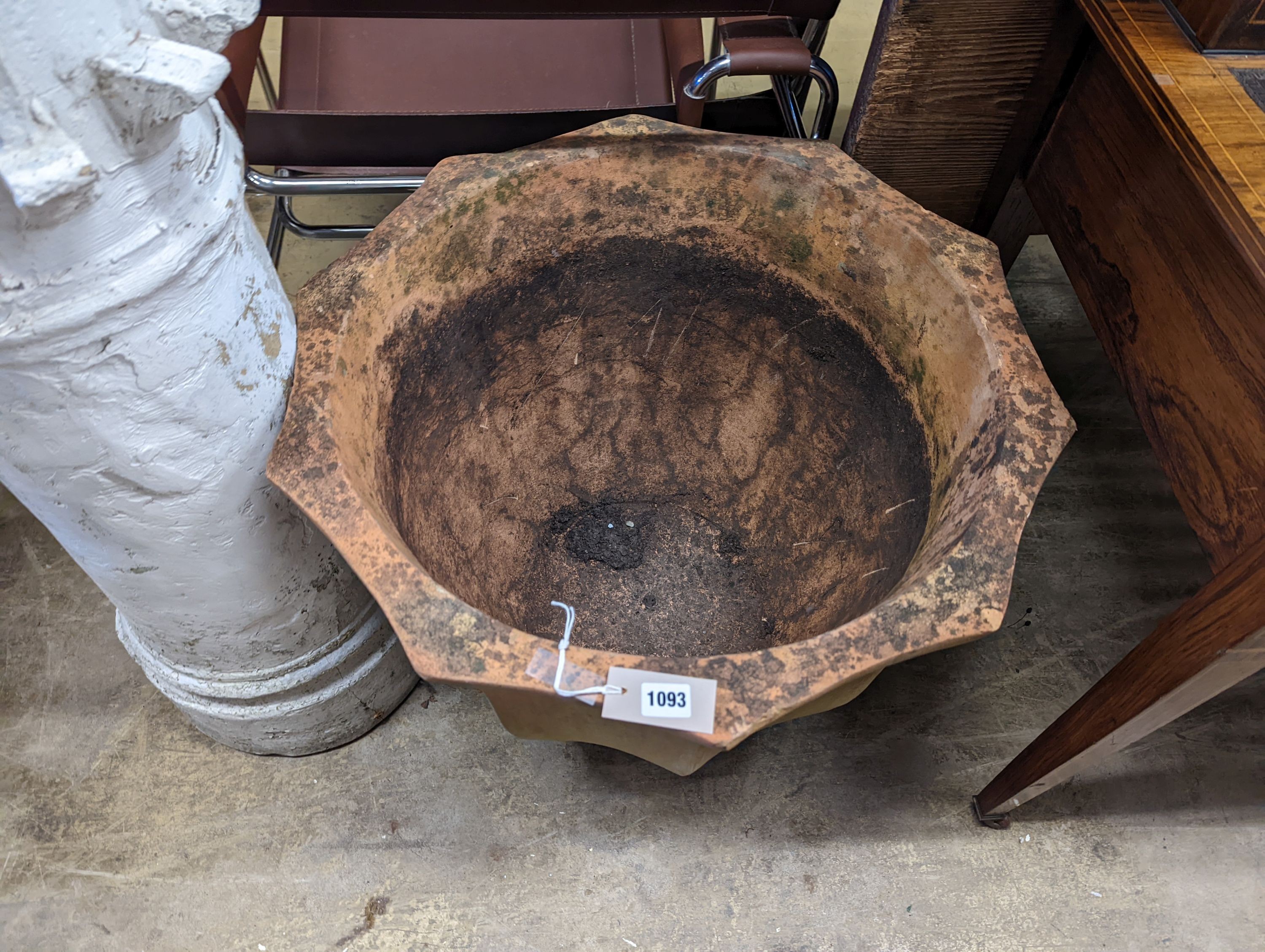 A large shaped circular terracotta garden planter, diameter 66cm, height 52cm